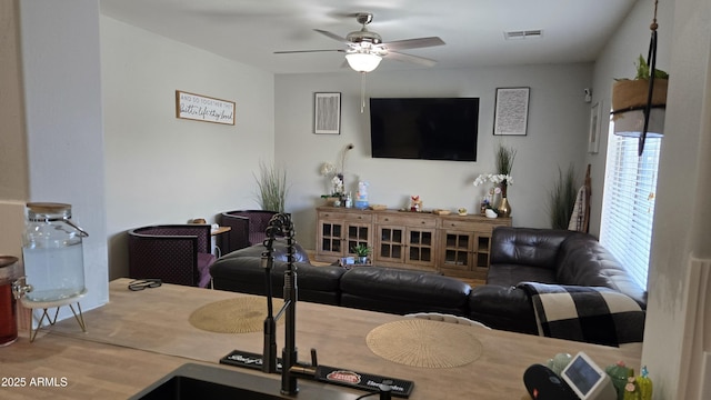 10036 W Chipman Rd, Tolleson, AZ 85353 - living area with a ceiling fan and wood finished floors