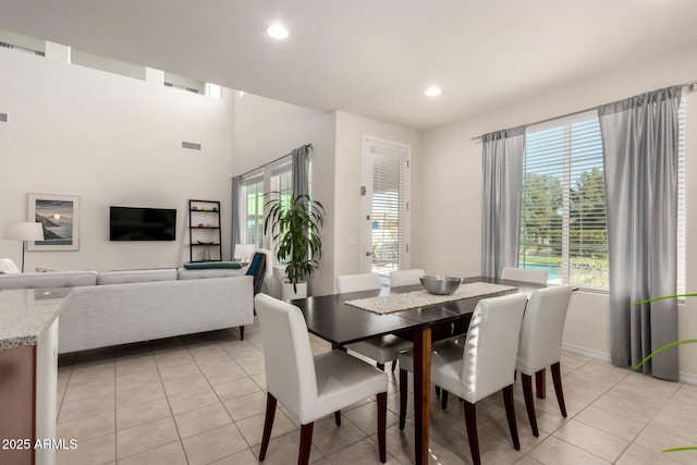 tiled dining room featuring a wealth of natural light