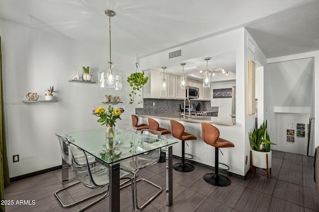 dining space with baseboards