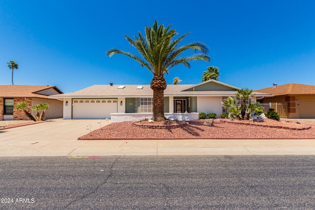 ranch-style home with a garage