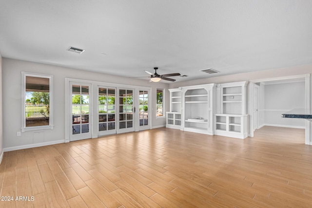 spare room featuring ceiling fan and light hardwood / wood-style floors