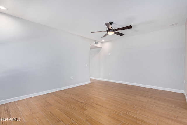 empty room featuring ceiling fan and light wood-type flooring