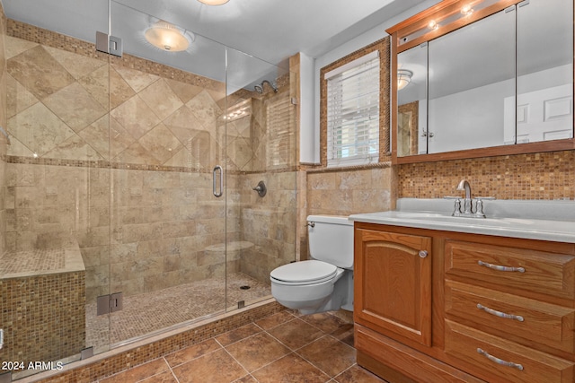 bathroom with tile walls, a shower with door, tile floors, and toilet