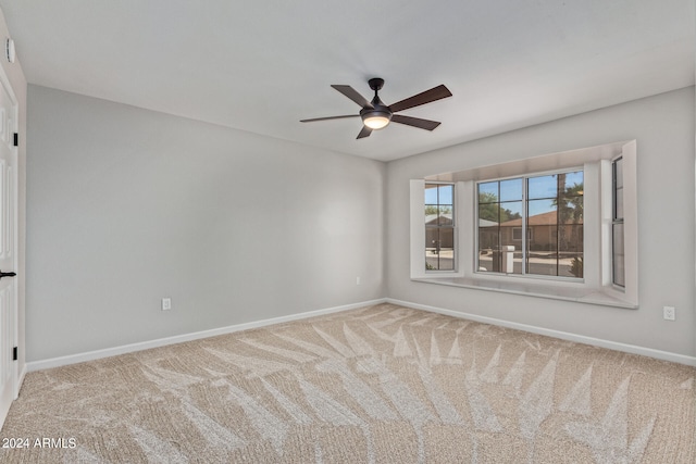 carpeted empty room with ceiling fan