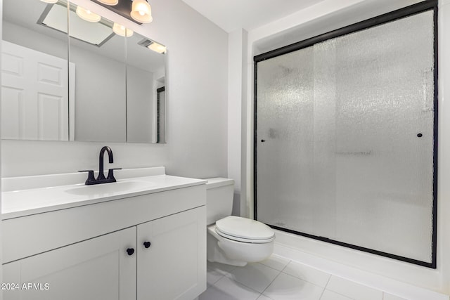 bathroom with an enclosed shower, toilet, tile floors, and large vanity