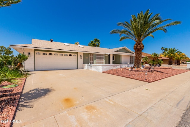 ranch-style house featuring a garage