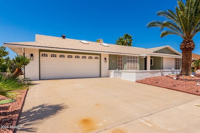 single story home featuring a garage