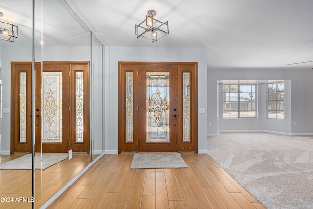 view of carpeted foyer