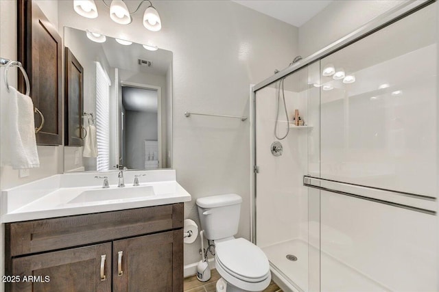 6503 E Bluefield Ave, Phoenix, AZ 85054 - full bathroom featuring a shower stall, toilet, vanity, and baseboards