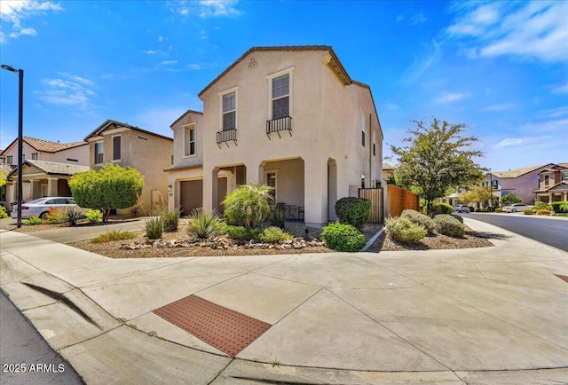 6503 E Bluefield Ave, Phoenix, AZ 85054 - mediterranean / spanish home with stucco siding, a residential view, a garage, concrete driveway, and a porch
