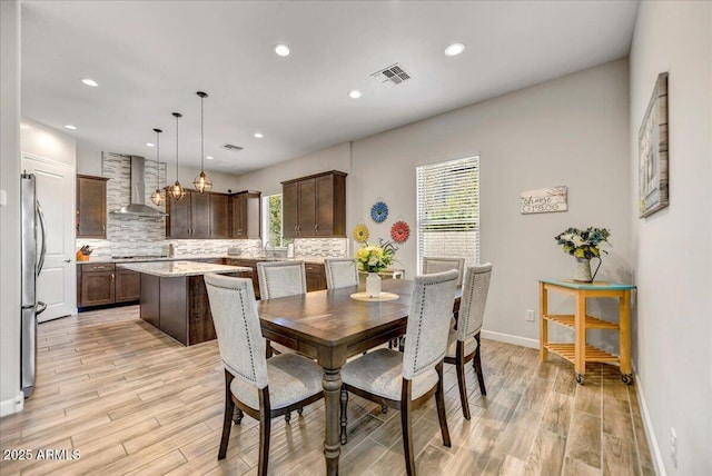 6503 E Bluefield Ave, Phoenix, AZ 85054 - dining room with light wood-type flooring, recessed lighting, and baseboards
