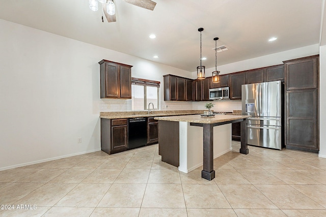 kitchen featuring stainless steel appliances, a breakfast bar area, a center island, pendant lighting, and decorative backsplash