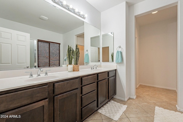 bathroom with tile patterned flooring and vanity