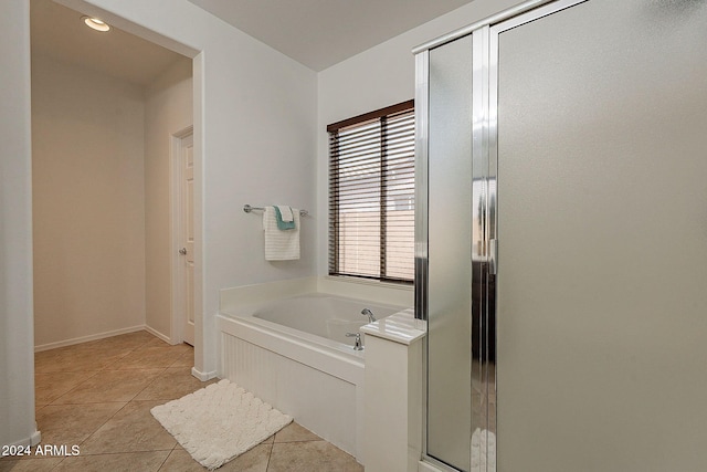 bathroom with tile patterned flooring and plus walk in shower