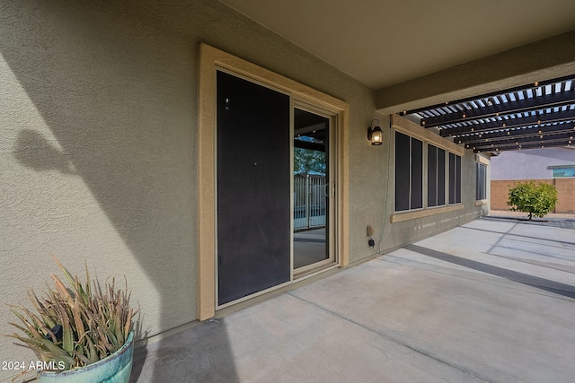 view of patio featuring a pergola