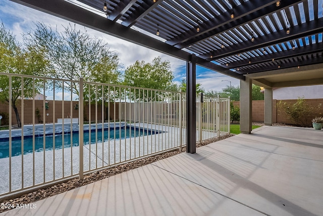 view of swimming pool with a patio area and a pergola