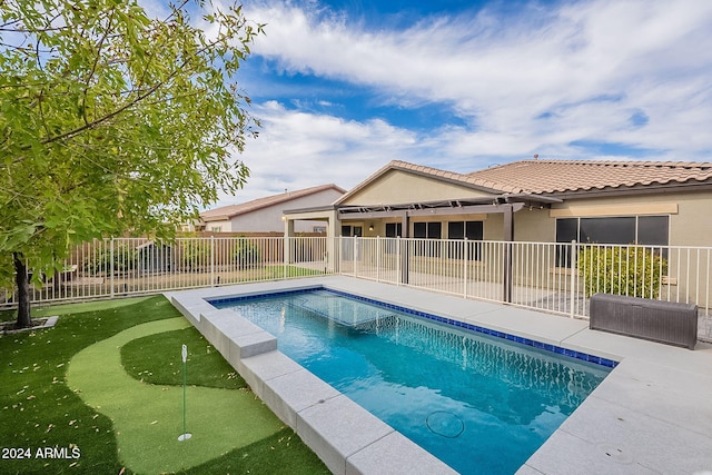 view of swimming pool with a patio area