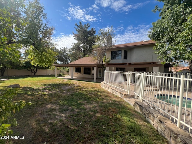 view of yard with a patio and a fenced in pool