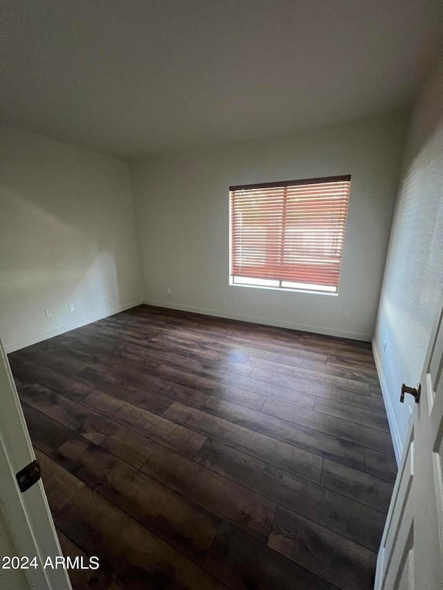 spare room with hardwood / wood-style floors