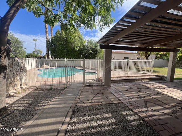 view of swimming pool with a patio, a fenced backyard, and a fenced in pool