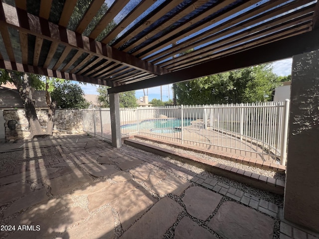 view of patio with a fenced backyard, a fenced in pool, and a pergola