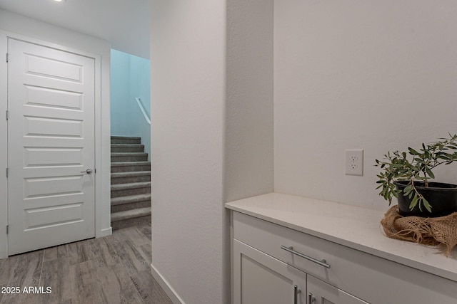 corridor featuring light hardwood / wood-style floors