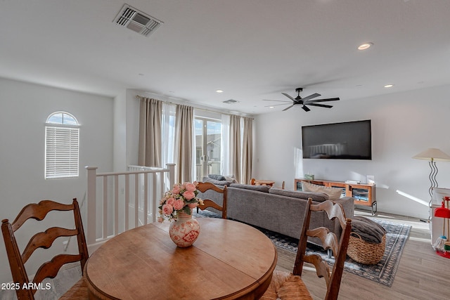 dining space featuring ceiling fan, a healthy amount of sunlight, and light hardwood / wood-style floors