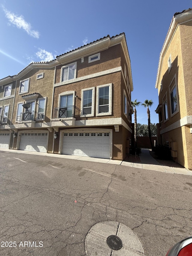 multi unit property featuring an attached garage