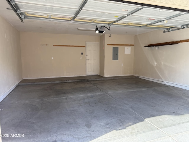 garage with a garage door opener and electric panel