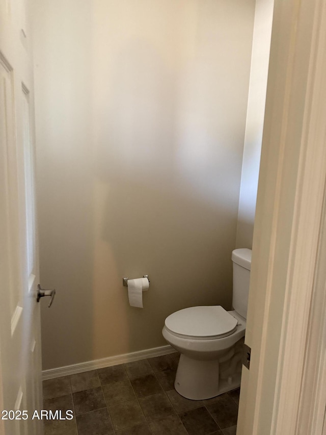 bathroom featuring tile patterned floors and toilet