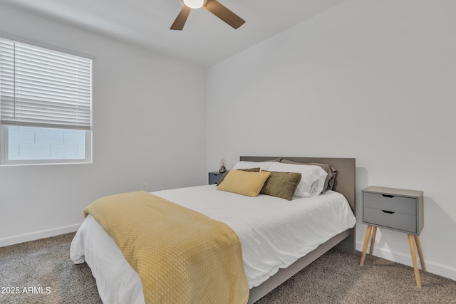 carpeted bedroom with baseboards and ceiling fan