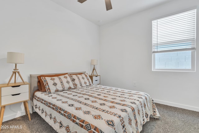 carpeted bedroom with baseboards and ceiling fan