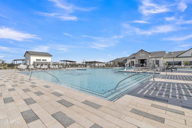 community pool with fence and a patio