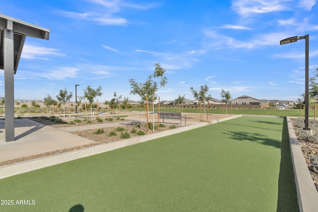 surrounding community featuring a game area and a residential view