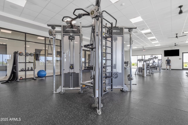 exercise room featuring a drop ceiling