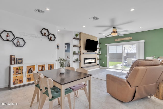 living room featuring a fireplace, a ceiling fan, recessed lighting, light tile patterned flooring, and baseboards