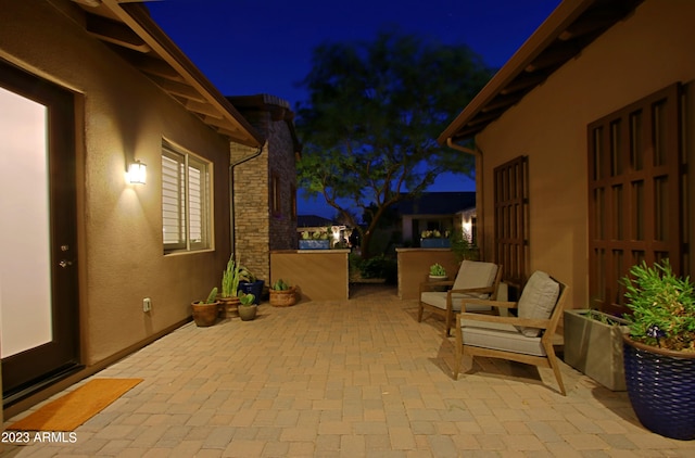 view of patio terrace at night