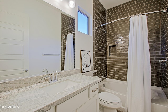 full bathroom featuring shower / bath combination with curtain, toilet, and vanity with extensive cabinet space