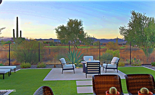 patio terrace at dusk with a lawn