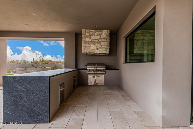 view of patio / terrace with a grill and exterior kitchen