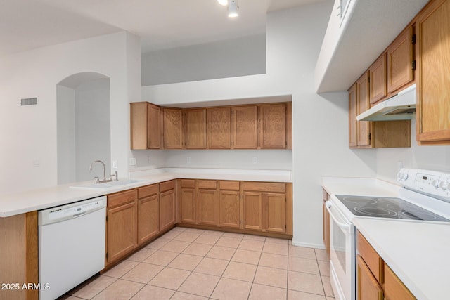 4336 E Aspen Ave, Mesa, AZ 85201 - kitchen featuring white appliances, under cabinet range hood, a peninsula, light tile patterned flooring, and light countertops