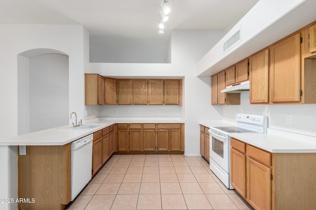 4336 E Aspen Ave, Mesa, AZ 85201 - kitchen with white appliances, under cabinet range hood, light tile patterned flooring, light countertops, and a peninsula