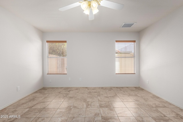 4336 E Aspen Ave, Mesa, AZ 85201 - empty room with healthy amount of natural light and ceiling fan