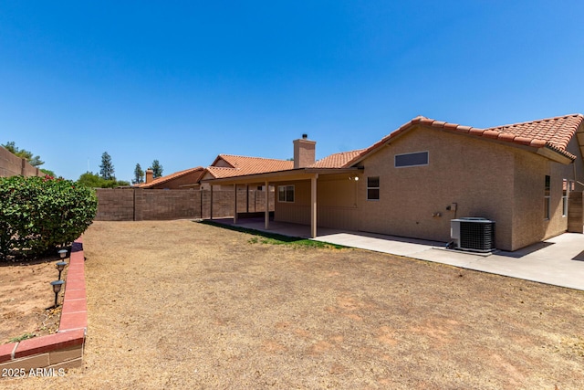 4336 E Aspen Ave, Mesa, AZ 85201 - rear view of house with a tile roof, a chimney, a fenced backyard, and a patio area