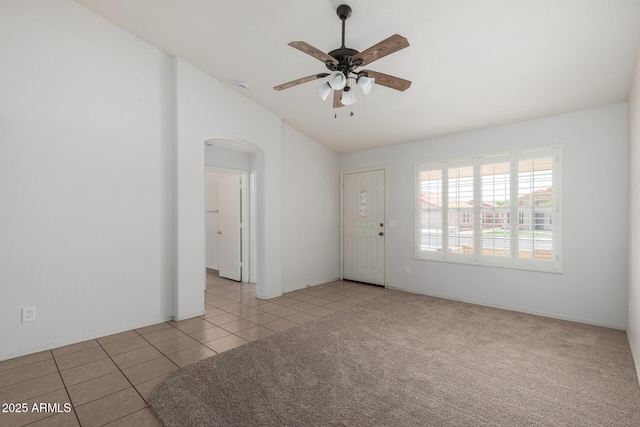 4336 E Aspen Ave, Mesa, AZ 85201 - empty room featuring arched walkways, lofted ceiling, a ceiling fan, tile patterned flooring, and a smoke detector