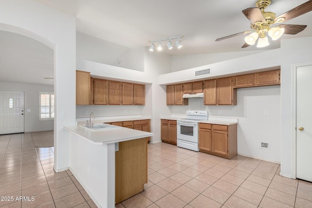 4336 E Aspen Ave, Mesa, AZ 85201 - kitchen featuring electric range, under cabinet range hood, brown cabinetry, light countertops, and light tile patterned floors