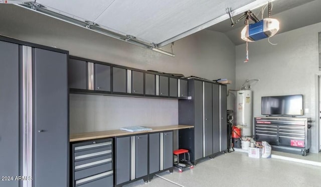 garage featuring gas water heater and a garage door opener