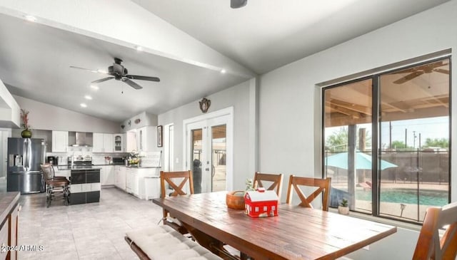 dining area featuring french doors, plenty of natural light, lofted ceiling, and ceiling fan