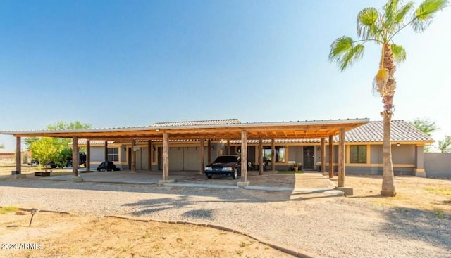 view of front of home featuring a carport