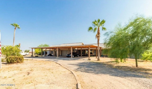 view of front facade featuring a garage and a carport